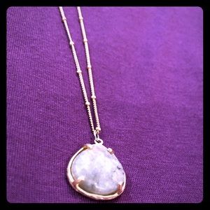 Gold pendant necklace with grey stone